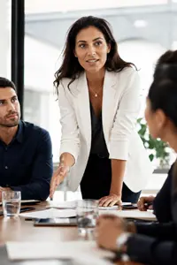 Confident professional leading a team discussion